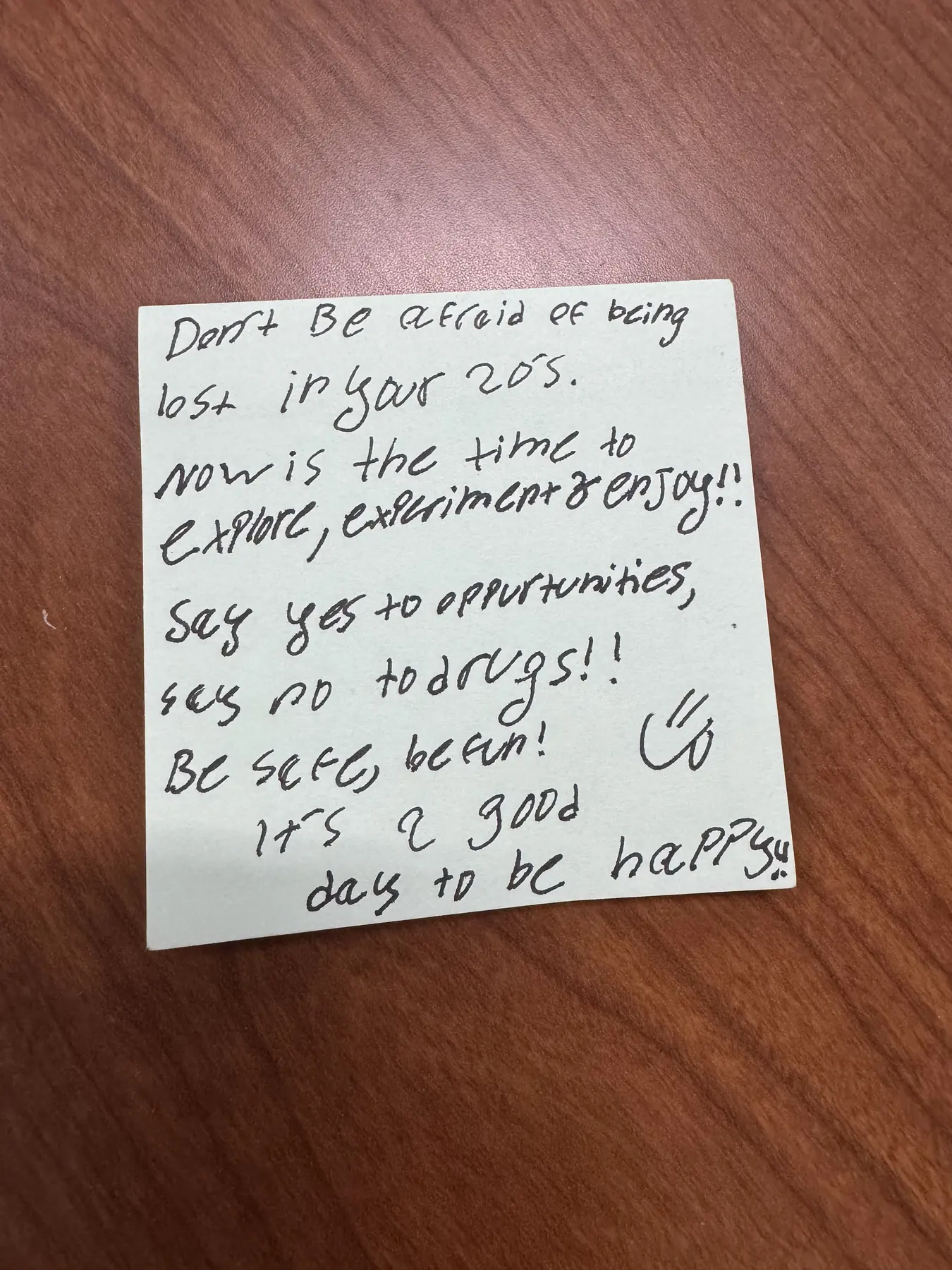 Handwritten sticky note with words of encouragement